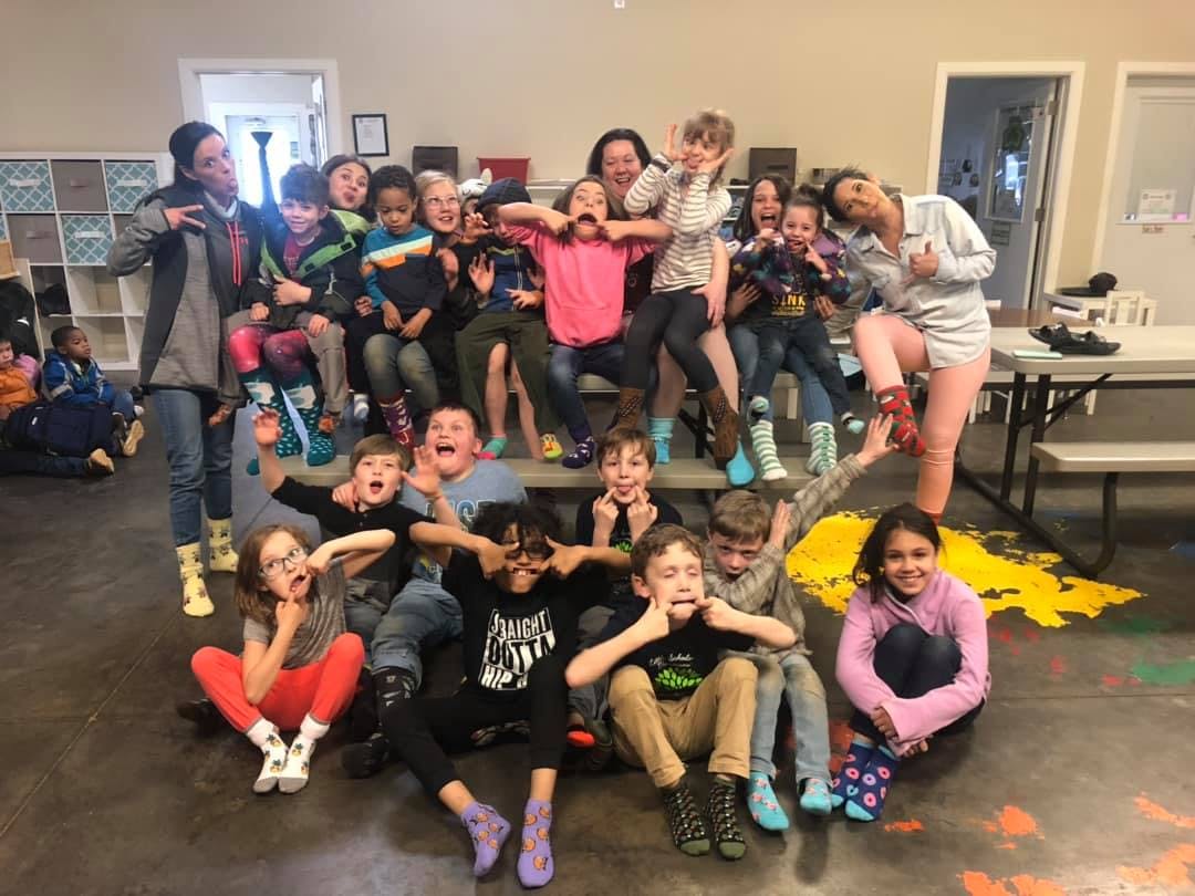 Group of adults and children making silly faces