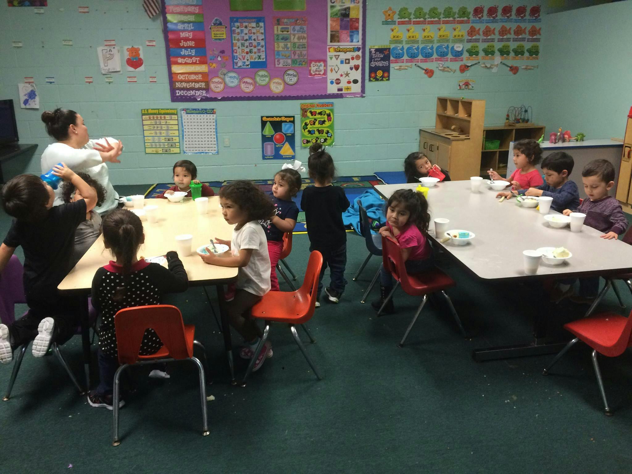 Adult and children in a classroom
