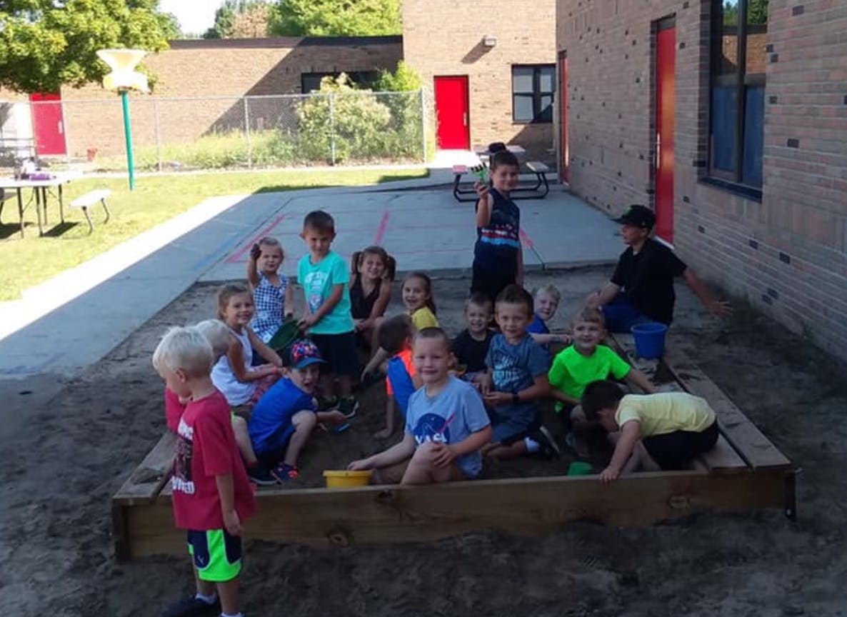 Group of children playing in a sandbox