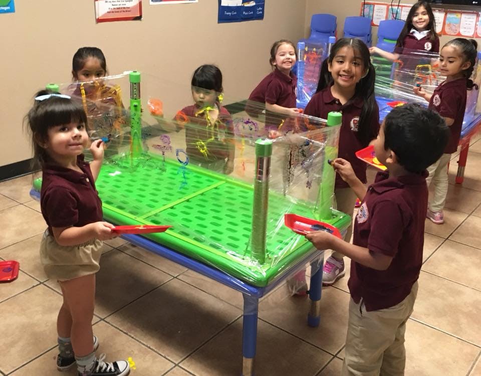 Children playing with a water table