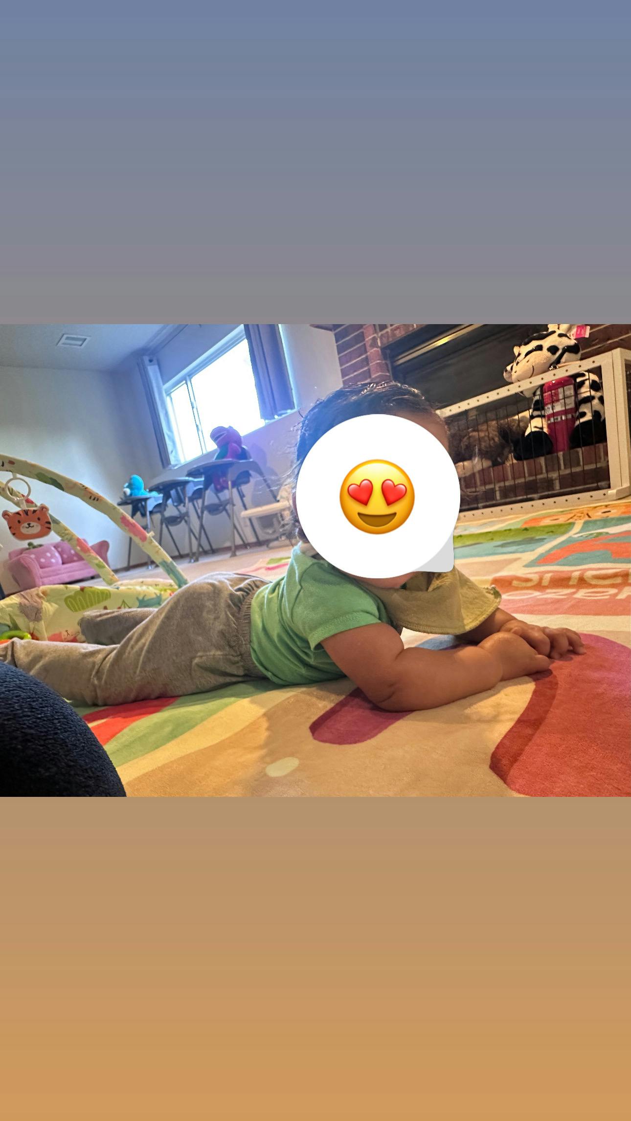 Child lying on a colorful mat