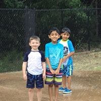 Three children standing in water