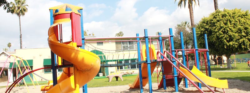 Colorful playground with slides and climbing structures