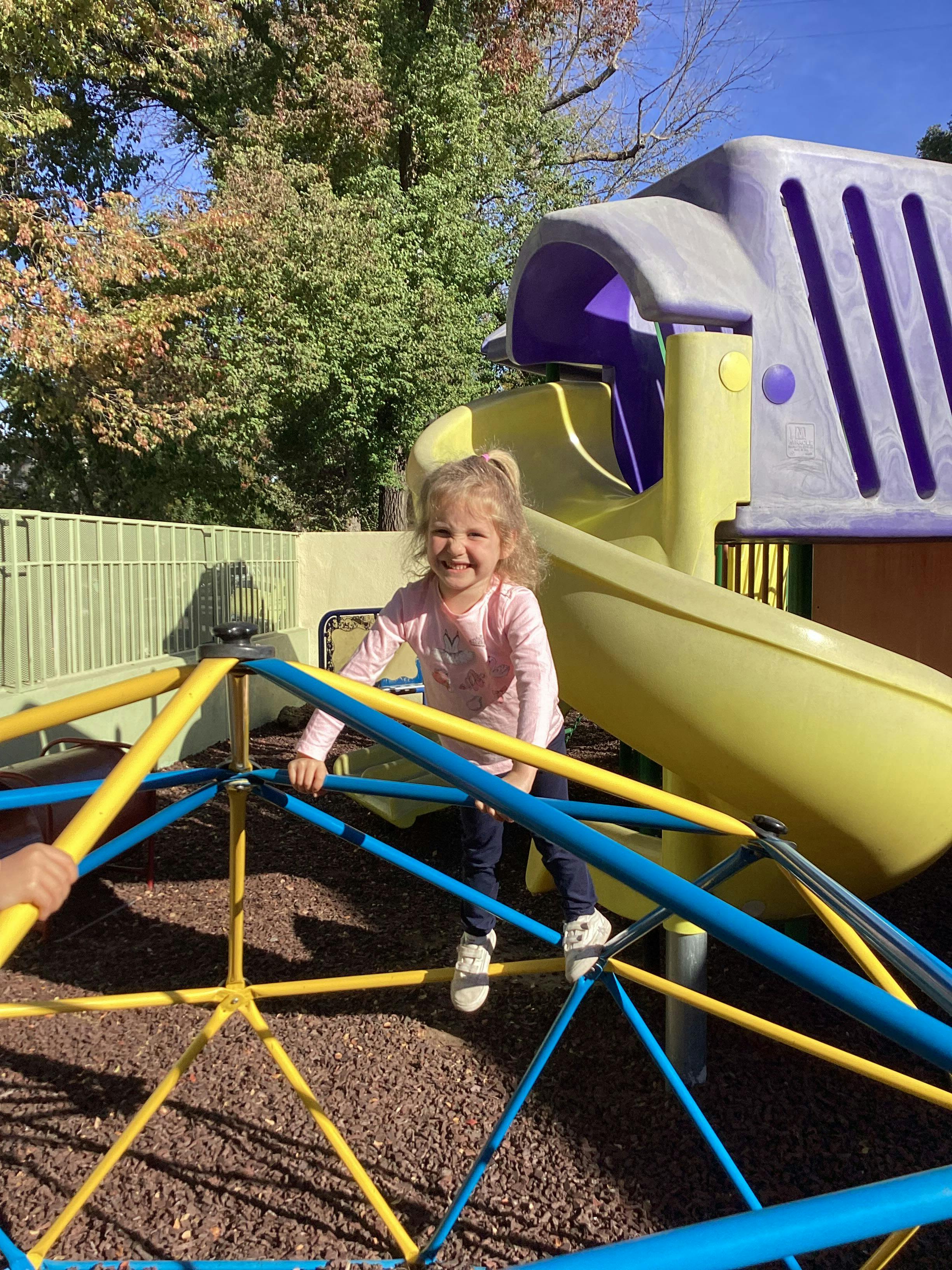 Child on a playground climbing structure