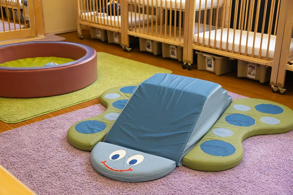 Caterpillar shaped foam climbing toy in a childcare room