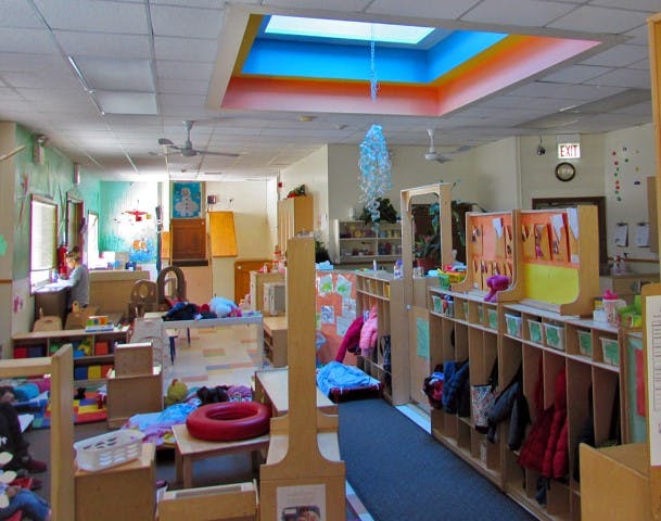 Classroom with a skylight, cubbies, and various learning materials