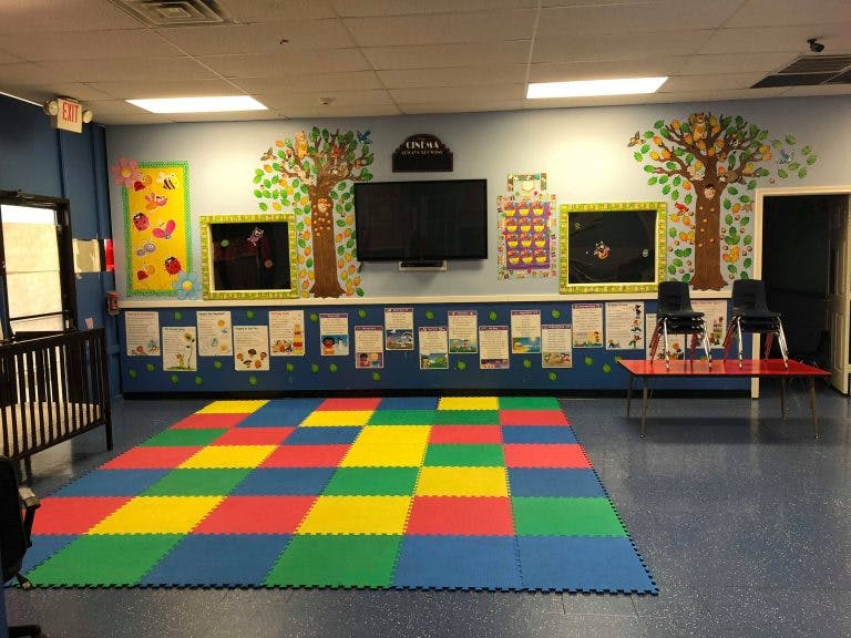 Playroom with colorful floor mats and wall decorations