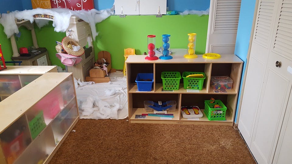 Classroom with shelves of toys and storage bins