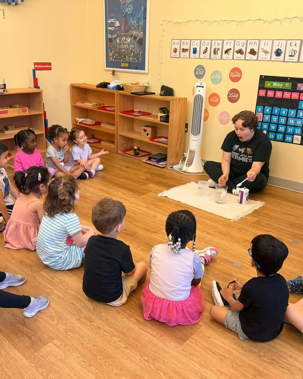 Adult leading activity for children in a classroom