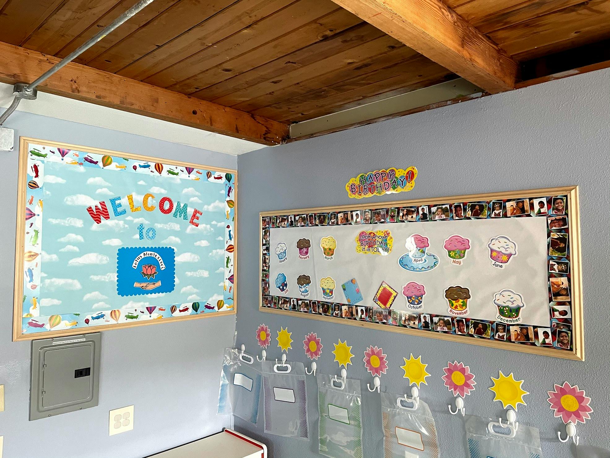 Two bulletin boards on a wall, one with "Welcome" text, the other with cupcakes