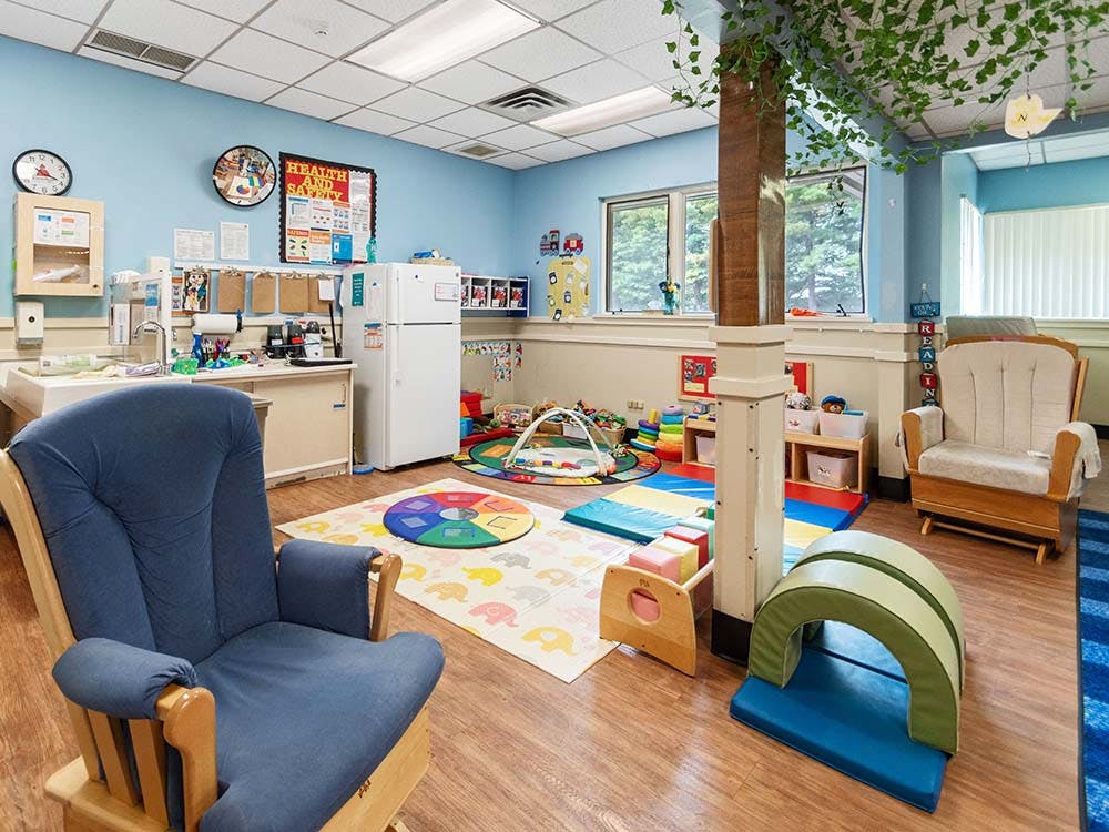 children's playroom with various toys and furniture