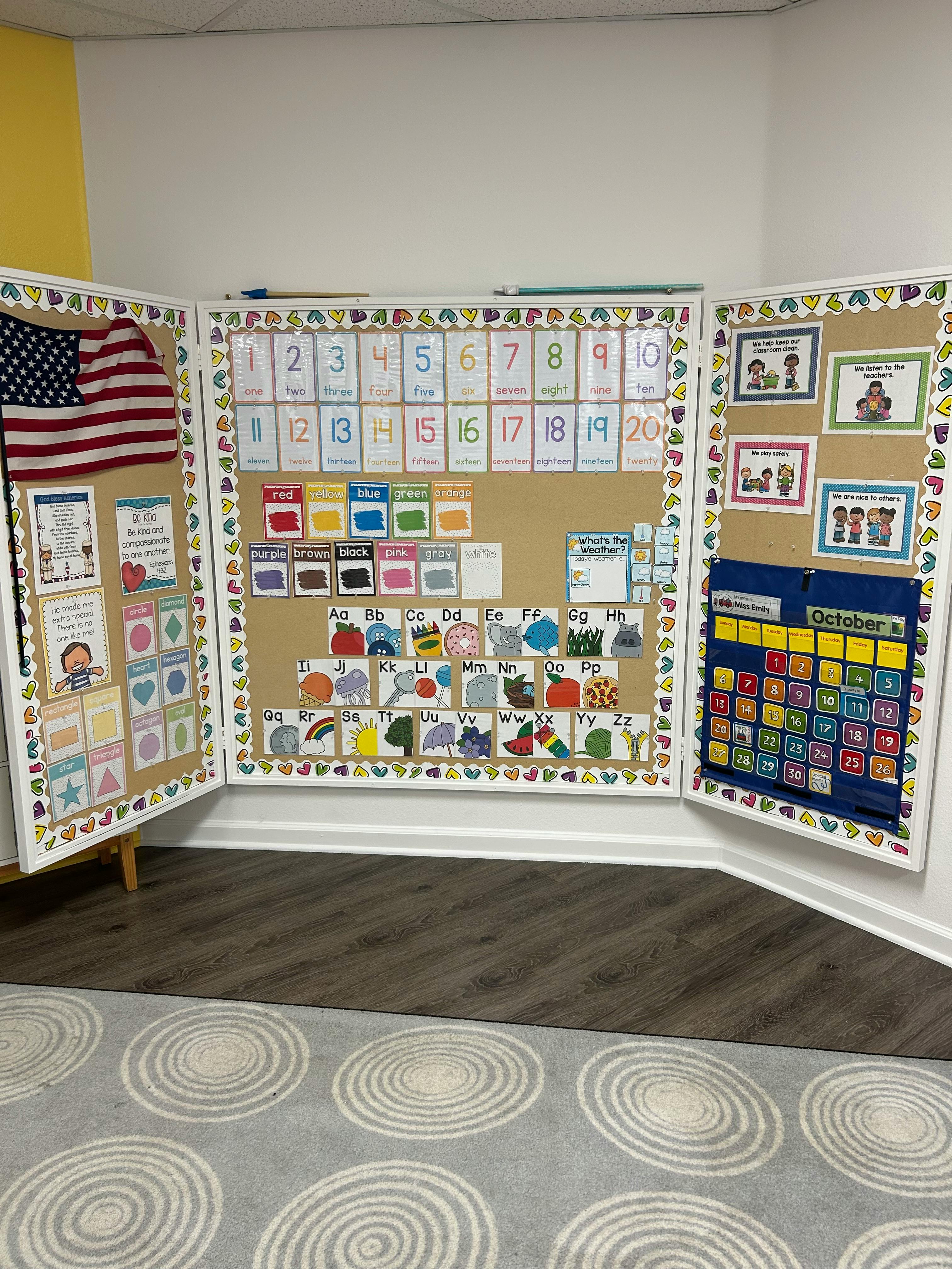 Classroom bulletin board with calendar, alphabet, and numbers