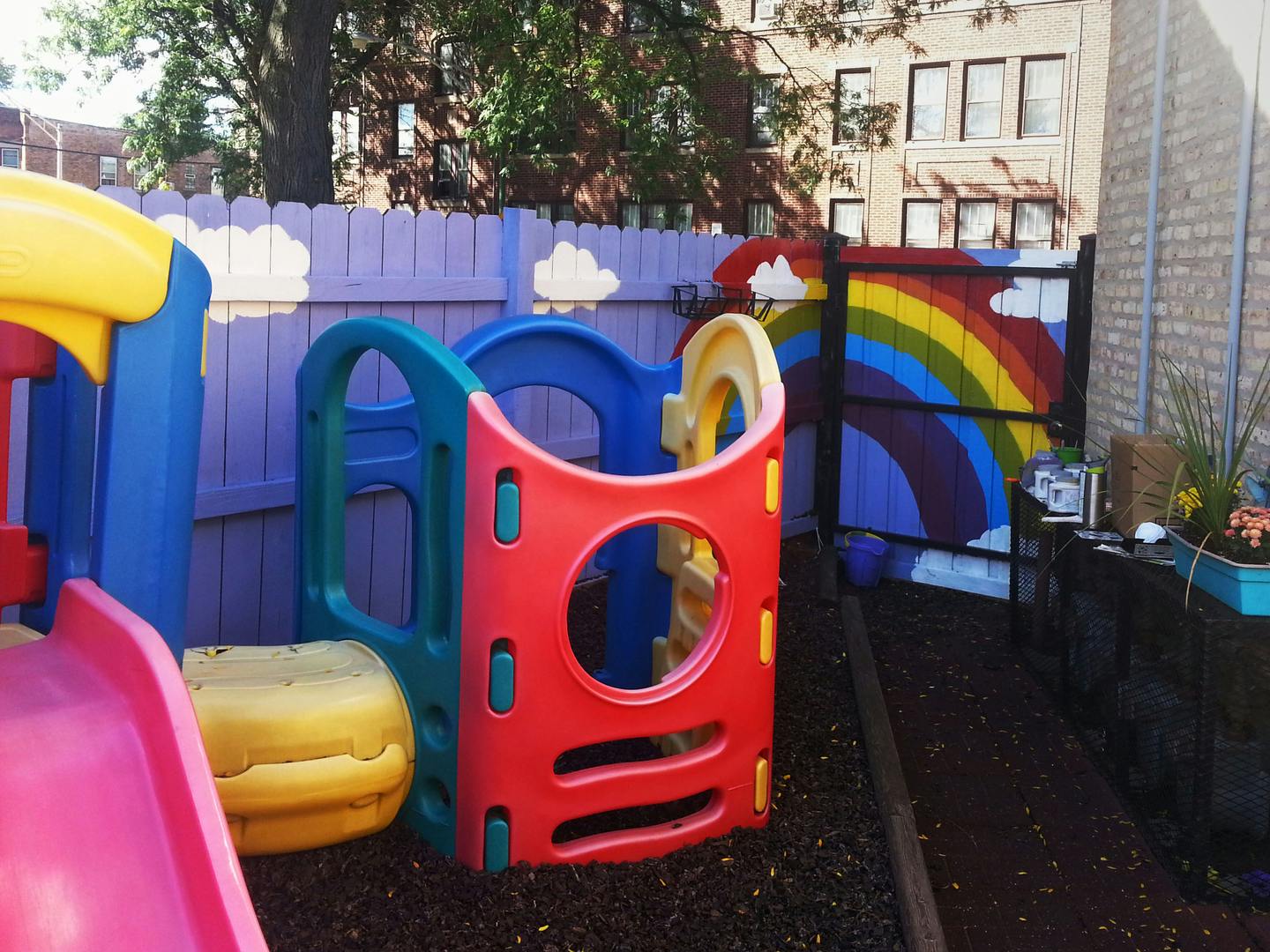 Colorful playground equipment with a slide and climbing structure