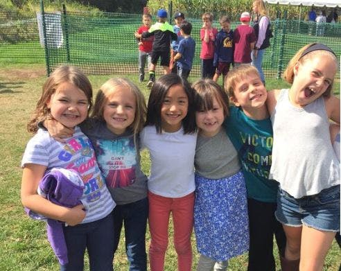Group of children standing together outdoors