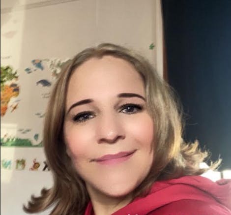 Close-up of a person with shoulder-length blonde hair