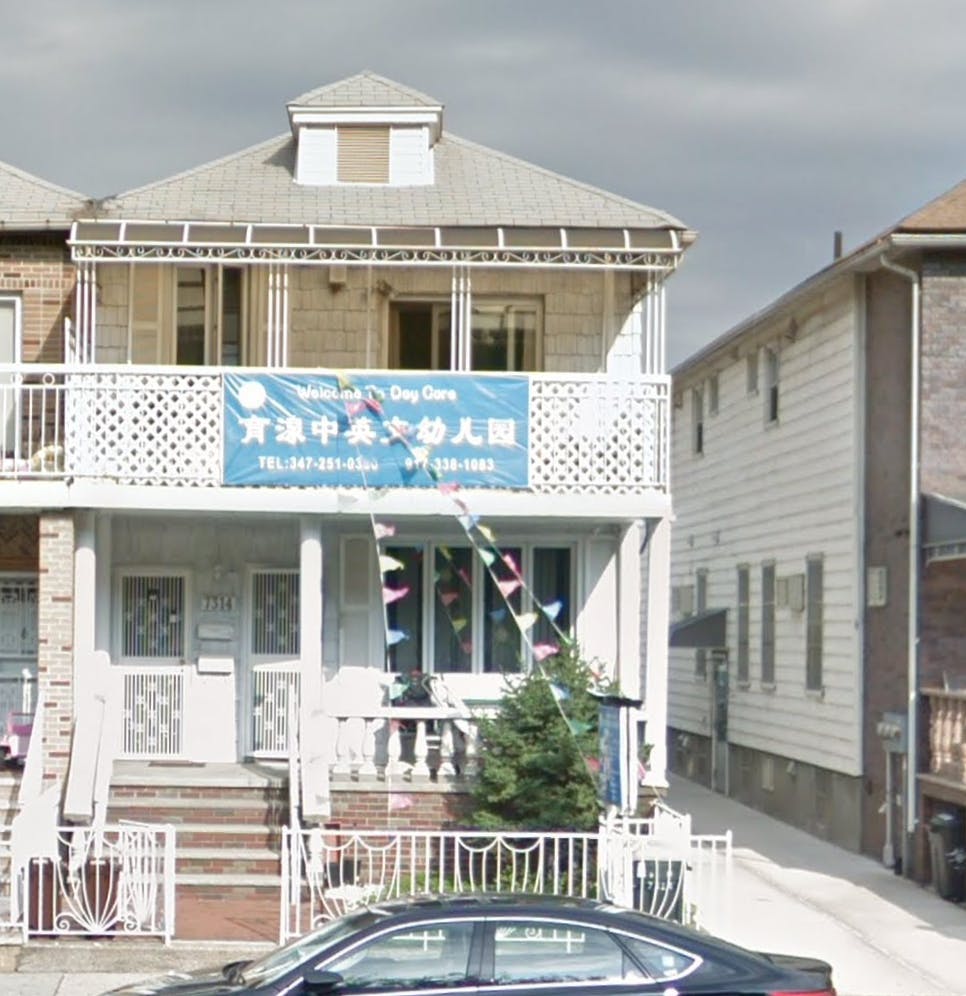 Two-story building with a blue banner on the second-floor balcony