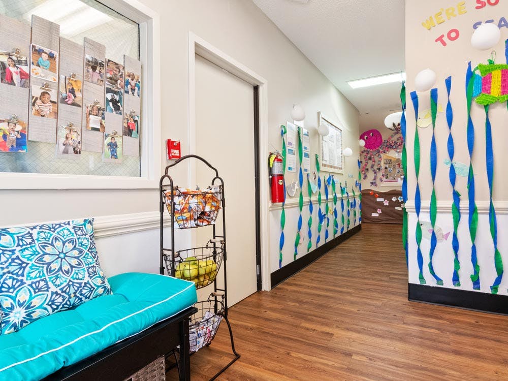 Hallway decorated with streamers and photos of children