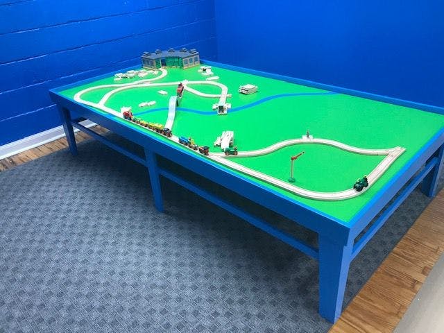 Toy train set on a green table