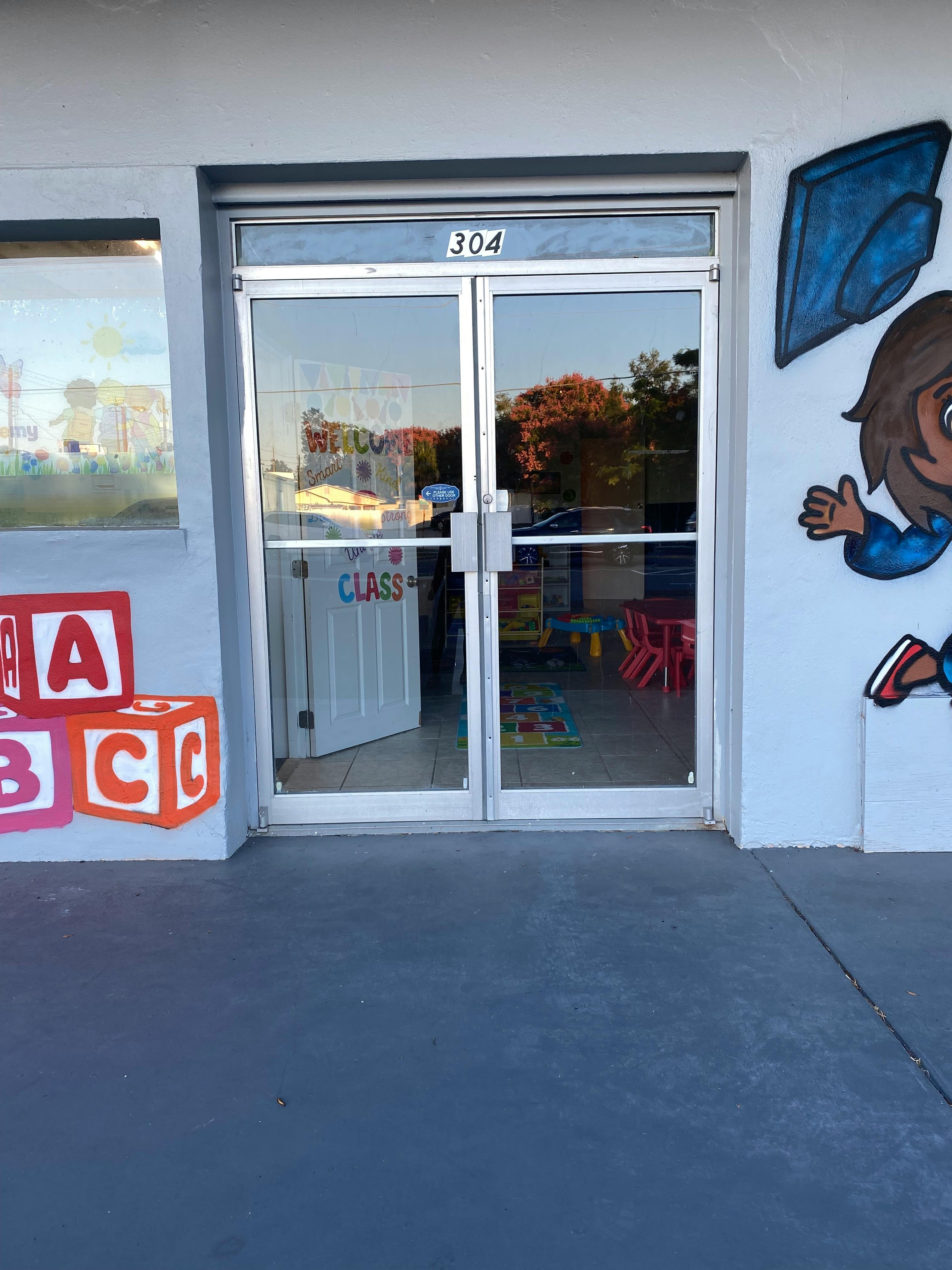Glass doors with "304" above and "CLASS" visible inside