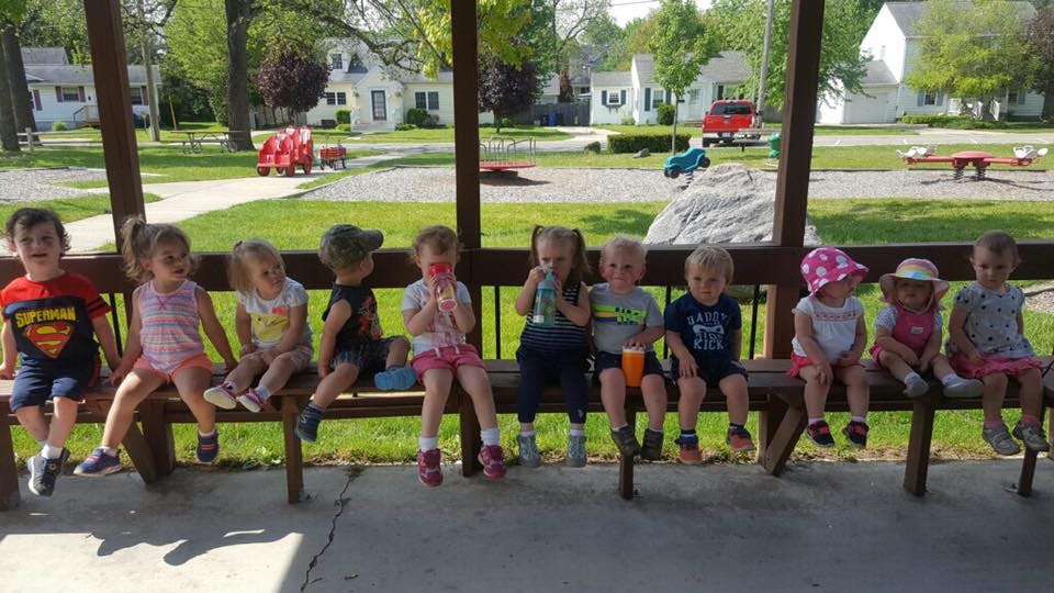 Group of children sitting on a bench