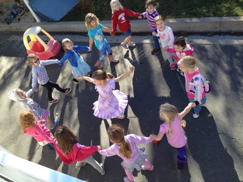 Children holding hands in a circle