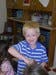 Child in striped shirt playing with toy