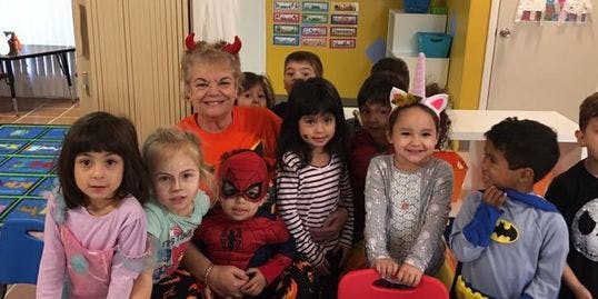 Adult and children in costumes