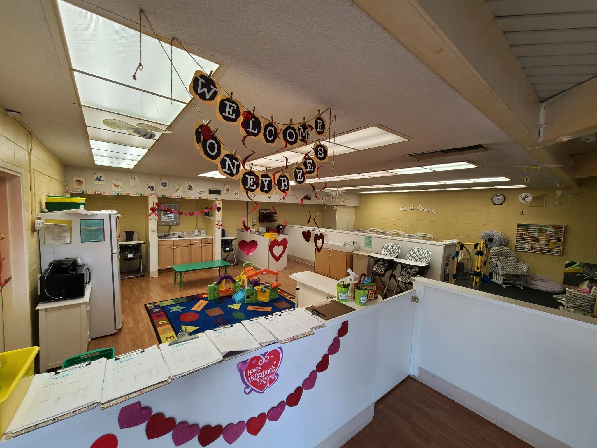 Daycare room with a welcome banner and heart decorations