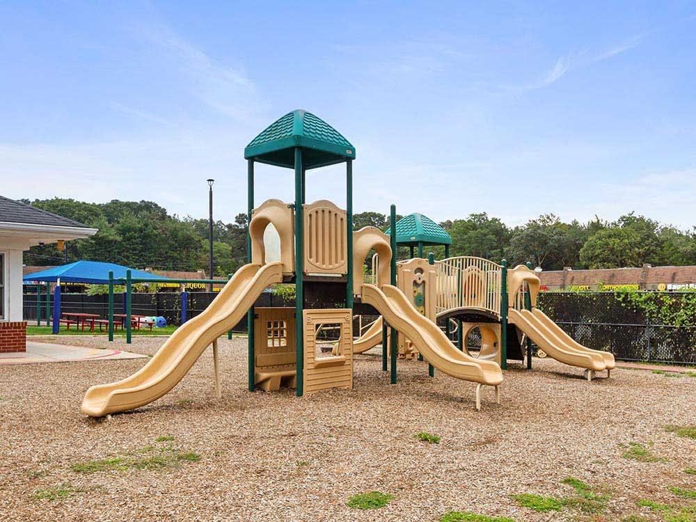 Playground with multiple slides and climbing structures