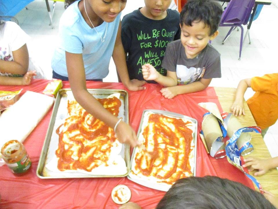 Children making pizza