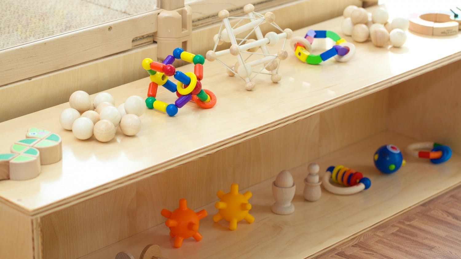 Wooden shelf with various children's toys