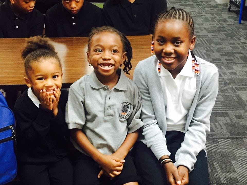 Three children sitting together