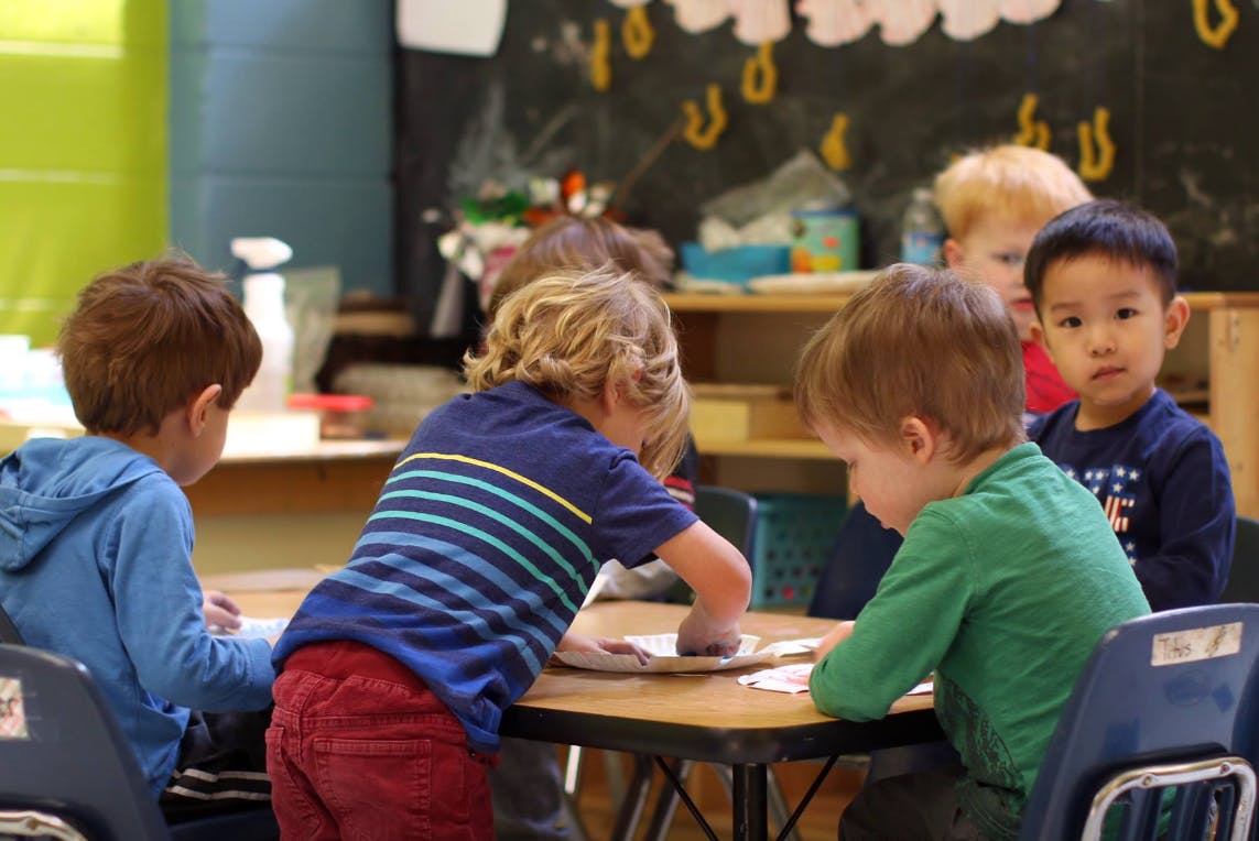 Children at a table in a classroom