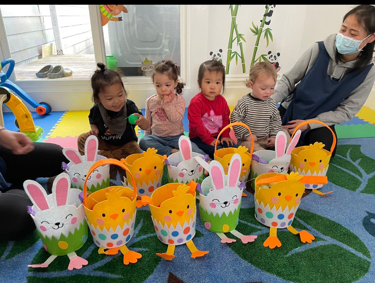 Children and an adult with Easter baskets