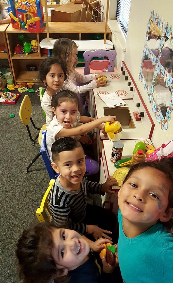 Children playing in a classroom