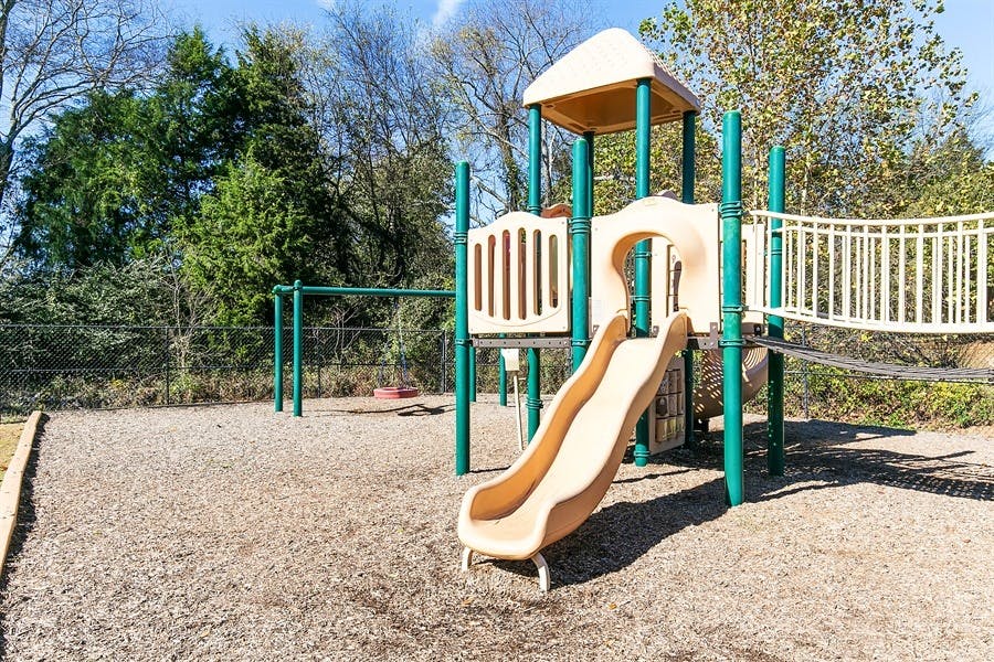 Playground with slide and monkey bars