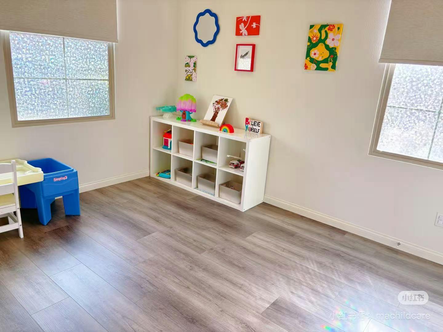 Empty room with a white storage shelf and a blue child's chair