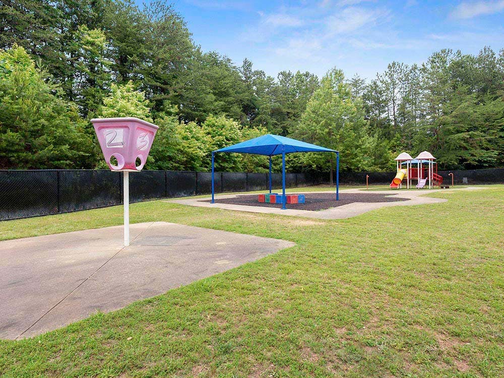 Playground with swings, slides, a covered picnic area, and a number game