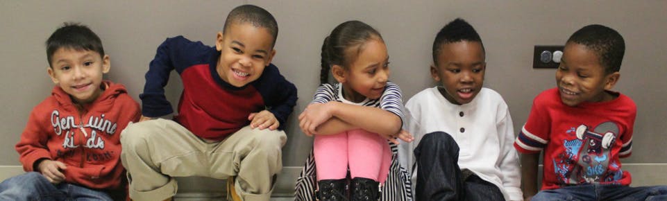 Five children sitting together