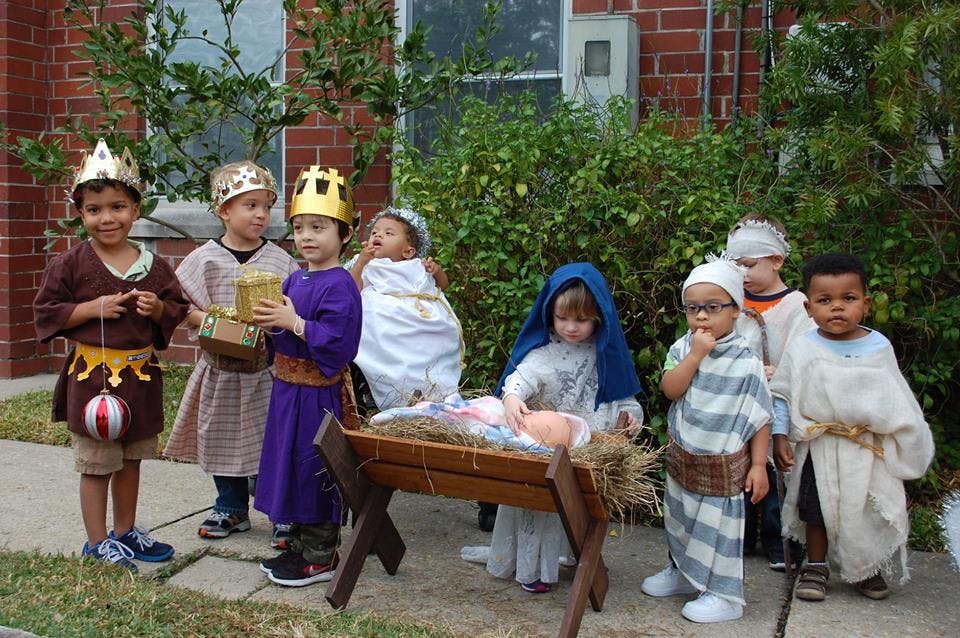 Children in costumes performing a nativity scene