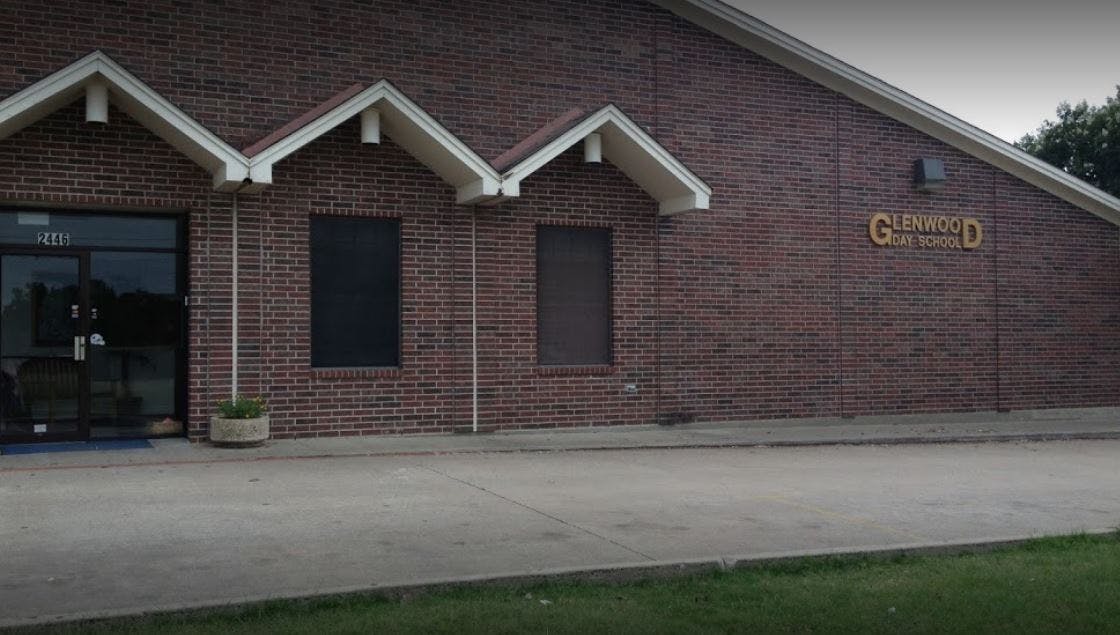 Brick building with multiple gables and a sign that reads "Glenwood"
