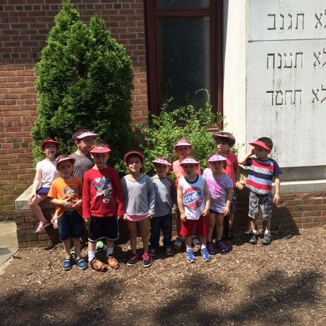 Group of children and adults standing outdoors