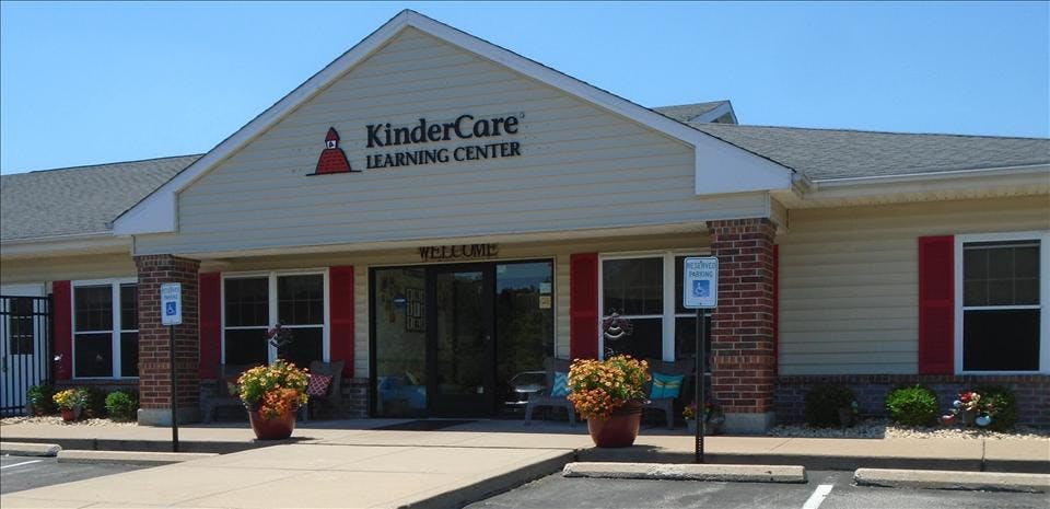 KinderCare Learning Center building exterior with red shutters