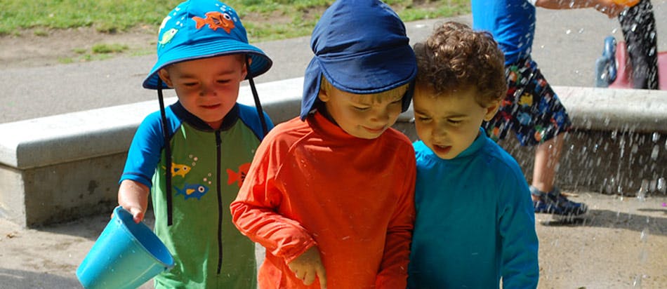 Three children playing outdoors