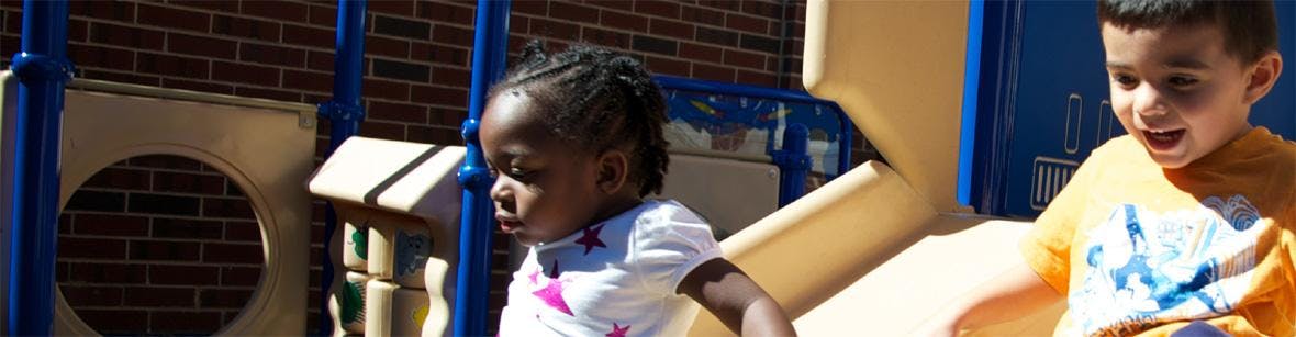 Two children on a playground structure