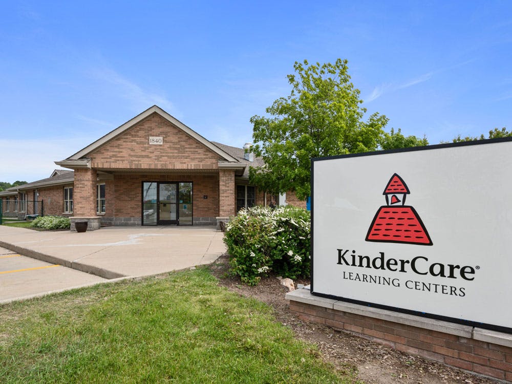 KinderCare Learning Centers sign in front of a brick building