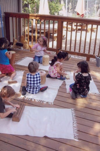 Children playing on a wooden deck