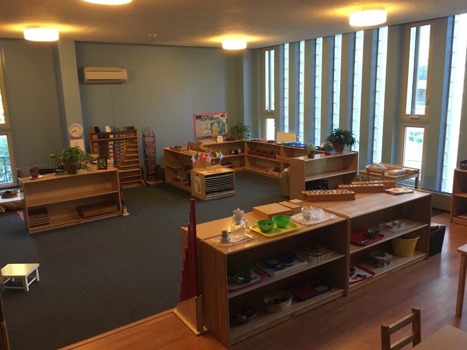 Classroom with wooden shelves and learning materials