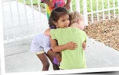 Two children hugging