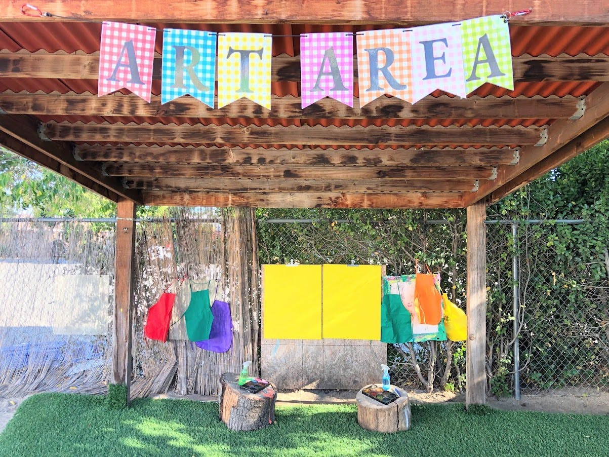 Outdoor play area with a banner that reads "ALT AREA"